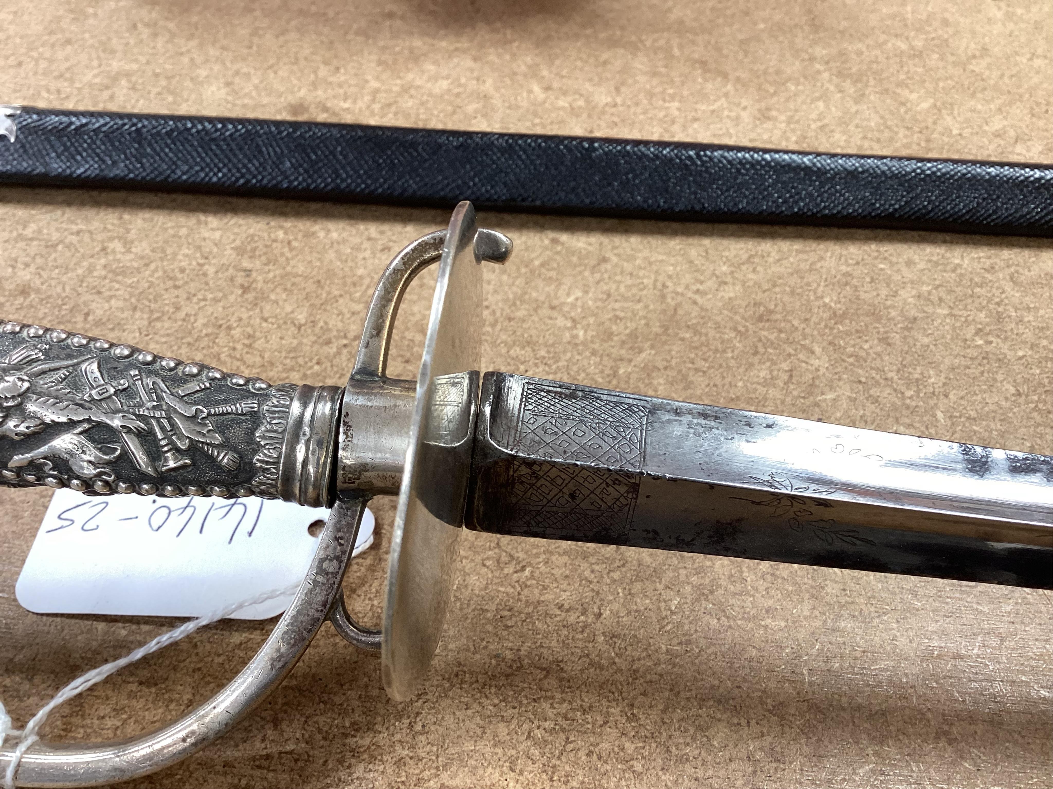 A late 18th century court sword with white metal grip, knuckle guard and mounts, decoration to scabbard band believe to be based on Admiral Duncan’s crest (Camperdown 1797), blade 84cm. Condition - fair to good, some wea